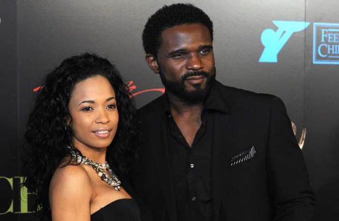 Karrine Steffans and Darius McCrary taking a photo together.